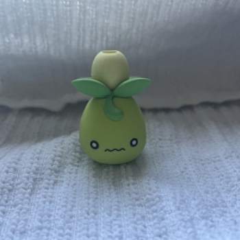 This complex object is an eraser of the Pokemon Smoliv. I bought this with my little sister and really enjoy collecting Pokemon trinkets with her so it makes me happy to see my Pokemon collection.